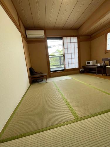 a room with a large rug on the floor at 癒し家 in Tokyo
