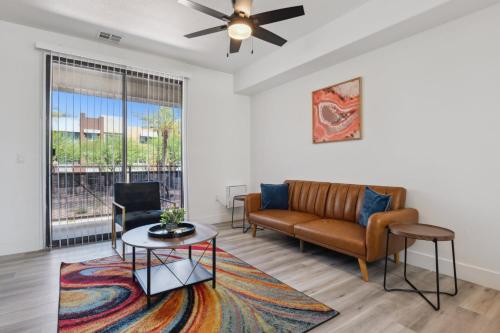 a living room with a couch and a table at CozySuites Glendale - Westgate w pool 15 in Glendale