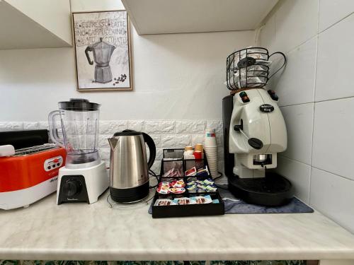 a kitchen counter with a blender on top of it at Piccolo Brasile Home in Capaci