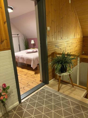 a sauna with a table and a bed in a room at Manni Homestay in Kuressaare