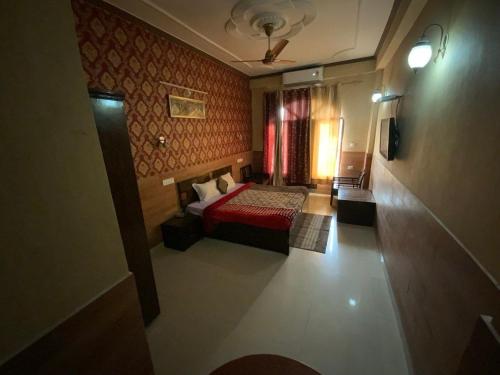 Postel nebo postele na pokoji v ubytování Hotel Nadaun Vilas