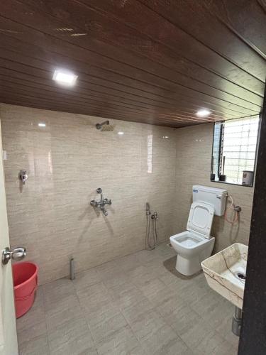 a bathroom with a toilet and a sink at Saanjh in Pali