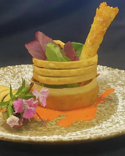 a bananaastery with flowers on a plate at Palala Boutique Game Lodge and Spa in Tom Burke
