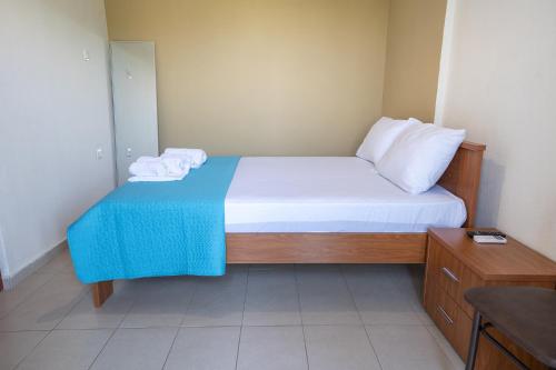 Ένα ή περισσότερα κρεβάτια σε δωμάτιο στο Mitro Apartments Stavros