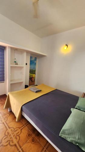 a bedroom with a large bed in a room at Happy Land in Varkala