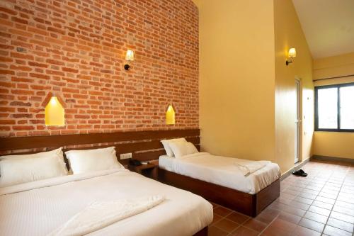 Voodi või voodid majutusasutuse Badreni Jungle Resort, Sauraha toas