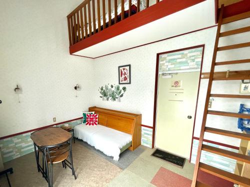 Ένα ή περισσότερα κρεβάτια σε δωμάτιο στο Lodge Y Lulu ロッジわいるる