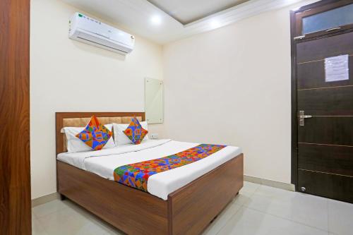 Ένα ή περισσότερα κρεβάτια σε δωμάτιο στο FabHotel The Hide Away