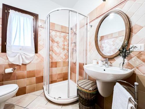 a bathroom with a sink and a shower at Ginestra house in Olbia