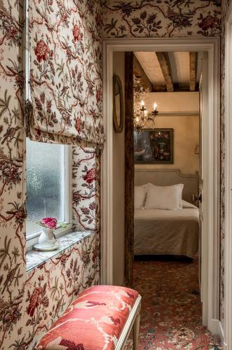 En eller flere senge i et værelse på Hotel Caron de Beaumarchais