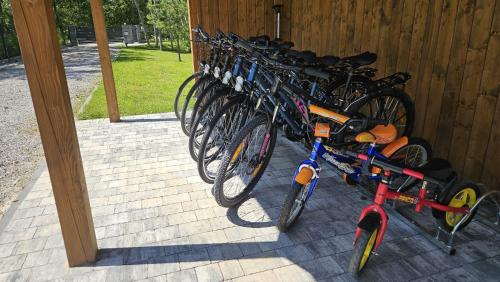 a group of bikes parked next to a building at Osada Mech i Fale in Tarnobrzeg