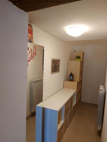 a kitchen with a white counter and a refrigerator at Al civico 78 in Vasto
