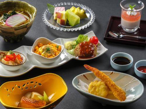 a table with plates of food and bowls of food at Mizunoto Reopening on April 1, 2025 in Hakone