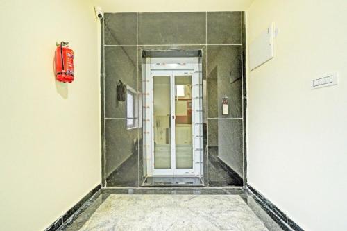 a corridor with a door in a room at Palette Hotel And Resorts Iskcon Temple Tirupati in Tirupati