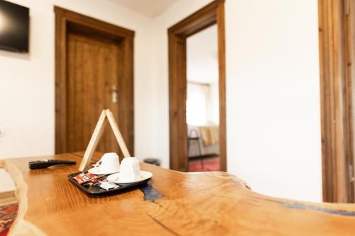 a wooden table with a pair of shoes on it at Ayaz Stone House in Goreme
