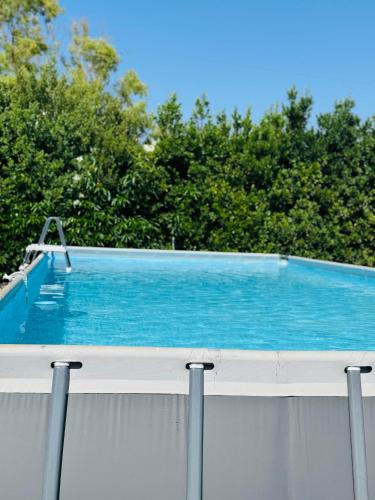 a swimming pool on the roof of a house at Il Casale di Luisa in Modica