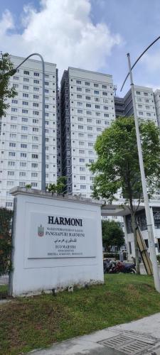 a sign in front of two tall buildings at J&K Guesthouse at Harmoni Apartment, Eco Majestic in Beranang