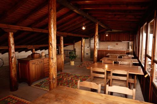 a dining room with wooden tables and chairs at Chardonnay Suites Hotel in Avanos