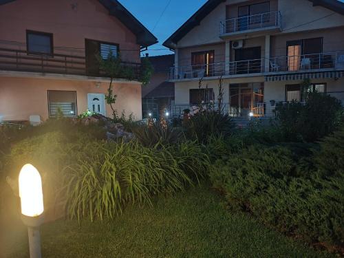a house with a light in front of it at Vila Nina 