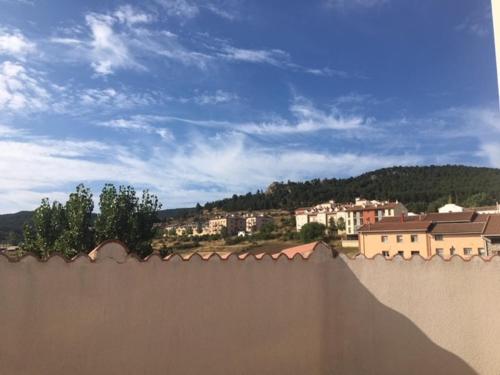 a view of a city from behind a wall at Ático con chimenea en Bronchales in Bronchales
