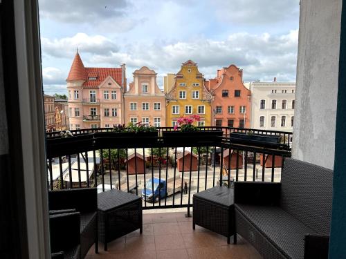 a view of a city from a balcony at Diamond Apartment in Grudziądz