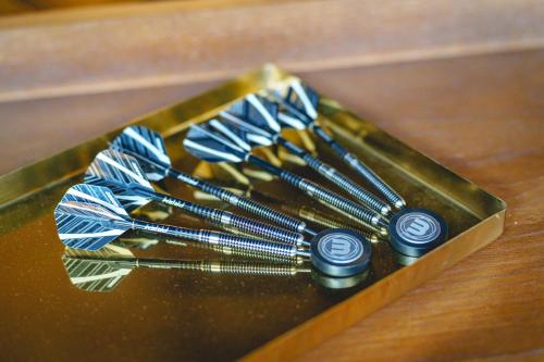 a group of forks and spoons in a box at The Originals Boutique, Hôtel Le Londres, Saumur in Saumur