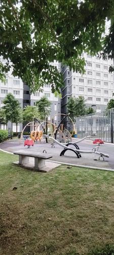 a park with a playground in a city at J&K Guesthouse at Harmoni Apartment, Eco Majestic in Beranang
