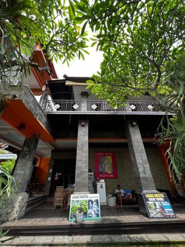 a building with a sign in front of it at Remedy in Lagas in Ubud
