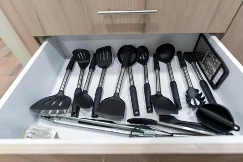 a drawer filled with lots of spatulas and utensils at Promo! 2BR-Pool-Views-King Bed-Walk 2 Beach-5 Star Area in Mazatlán