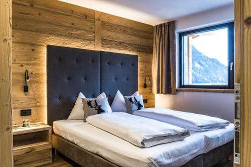 Ένα ή περισσότερα κρεβάτια σε δωμάτιο στο Apartments Grunnes