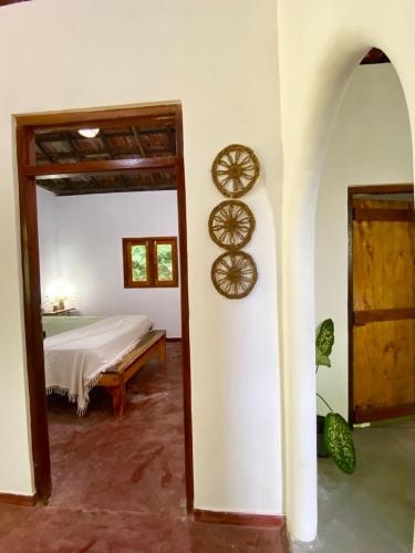 a bedroom with a bed andokedokedokedoked at Hello Homestay in Galle