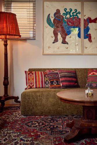 a living room with a couch and a table at Hotel Miss Blanche in Groningen