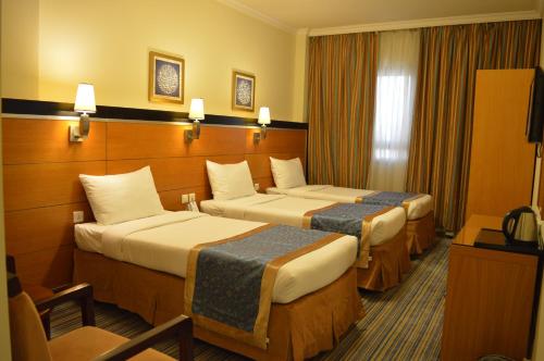 Katil atau katil-katil dalam bilik di Durrat Al Eiman Hotel