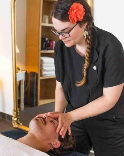 a woman in a salon getting her hair cut at The Originals Boutique, Hôtel Le Londres, Saumur in Saumur