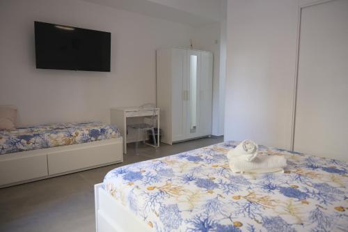 a bedroom with a bed with a towel on it at Nonna Francesca 2 in Patti