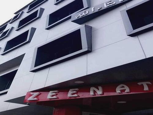 a building with a sign on the side of it at Hotel O 62748 Hotel Zeenat in Jammu