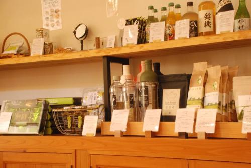 a shelf with bottles of wine on it at 風香る森のホテル鈴桃rindou in Shizuoka