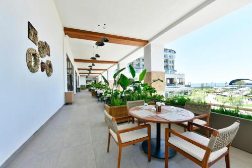 a dining room with a table and chairs at Ethno Belek in Belek