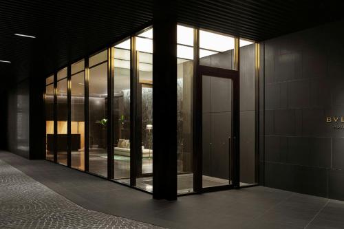 a building with large glass windows in a building at Bvlgari Hotel Tokyo in Tokyo