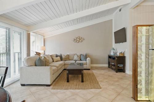 a living room with a couch and a table at Hilton Head Beach Villas 20 in Hilton Head Island
