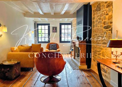 a living room with a couch and a table at Town House in Guingamp
