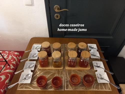a table with several jars of honey on it at Casa Dona Antonia - Monsaraz in Monsaraz