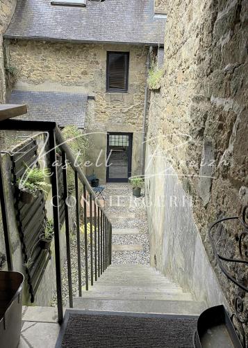 a stairway leading up to a stone building at Town House in Guingamp