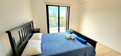 a bedroom with a bed with two stuffed animals on it at Hillside Azure in Polis Chrysochous