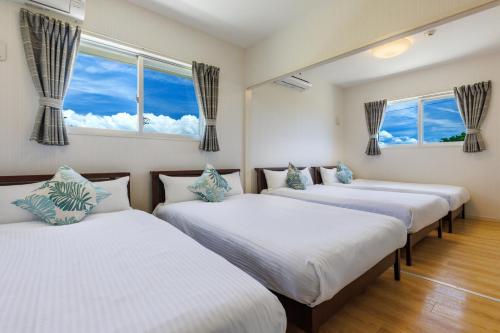 Ένα ή περισσότερα κρεβάτια σε δωμάτιο στο Large garden & BBQ possible! Kouri Island, 6 people can stay, parking lot available Kouri base Noa