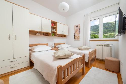 Postel nebo postele na pokoji v ubytování Villa Oliva