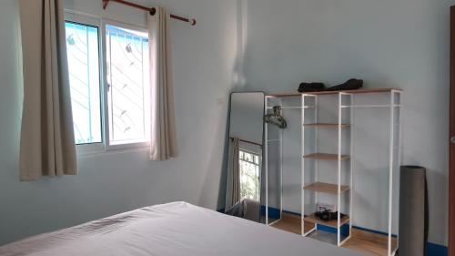 En eller flere senge i et værelse på Temple Light