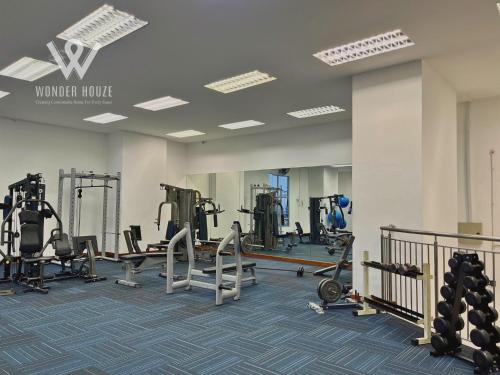 a gym with treadmills and machines in a building at 5pax Serene 3BR at Simfoni Heights with Batu Caves View in Batu Caves