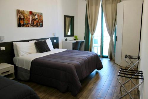 Ένα ή περισσότερα κρεβάτια σε δωμάτιο στο Bed and Breakfast Stella del Sud Makari