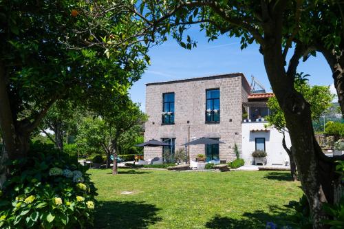 an external view of the house from the garden at 1912 Relais - Sorrento Coast in Piano di Sorrento